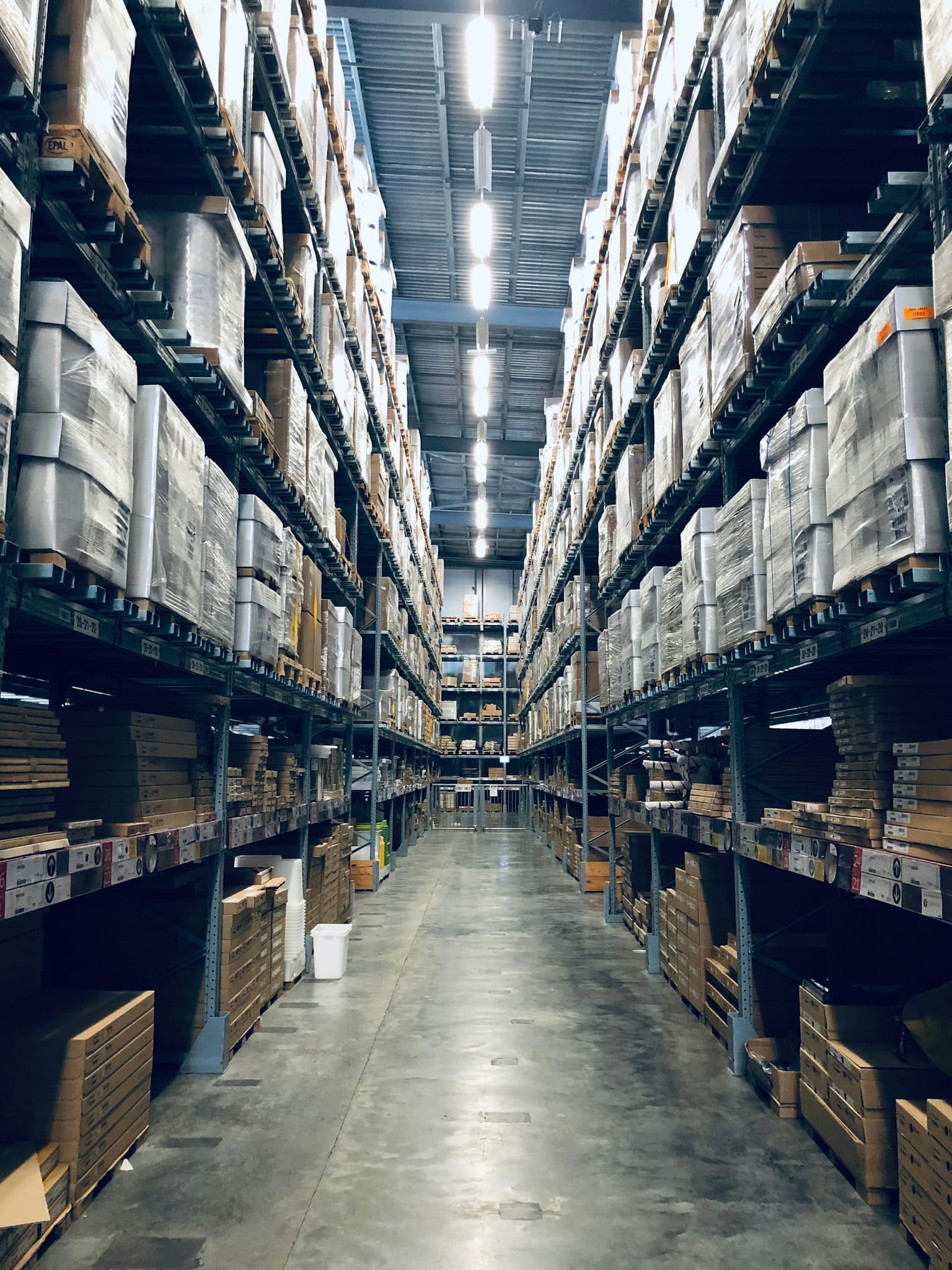 Warehouse shelving where stock, orders, and dispatch all have to stay in sync