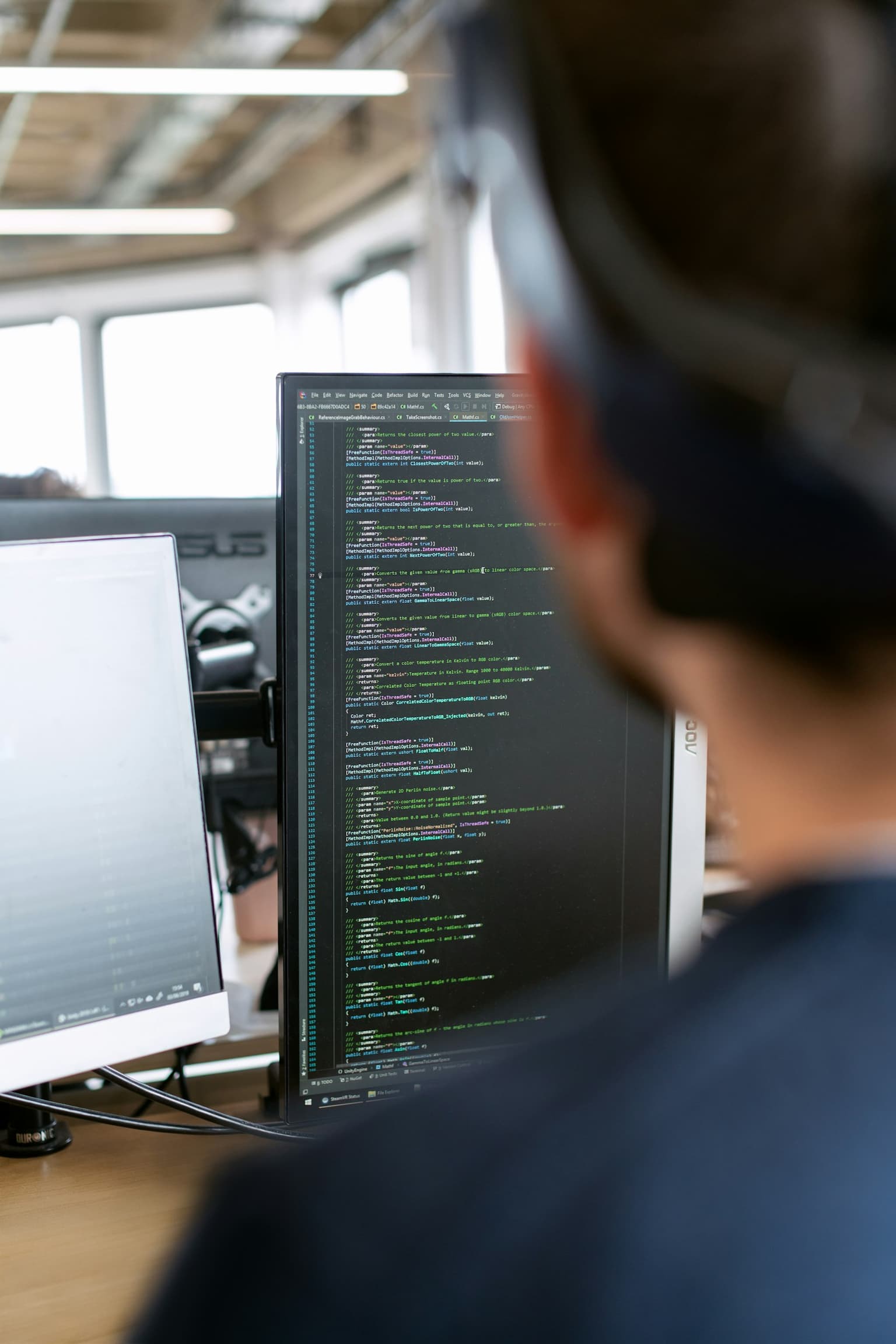 A developer writing integration code at a monitor